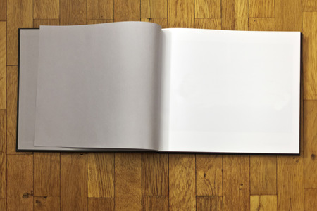empty book on wood bacgroung to fill inの写真素材