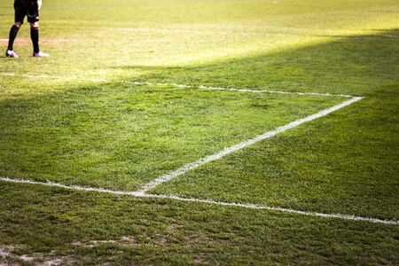 feet of footbal player running for competitionの写真素材