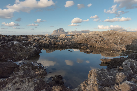 Sky Reflections among rocksの写真素材