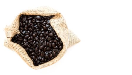 Roasted Coffee Beans in Jute Bag on white background with Copy Space. Top Viewの写真素材