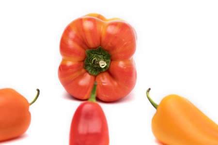 Variegated pepper red and yellow with mini peppers on white background. Health Conceptの写真素材