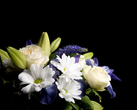 Funeral Bouquet purple White flowers, Sympathy and Condolence Concept on blackbackground with copy space.の写真素材