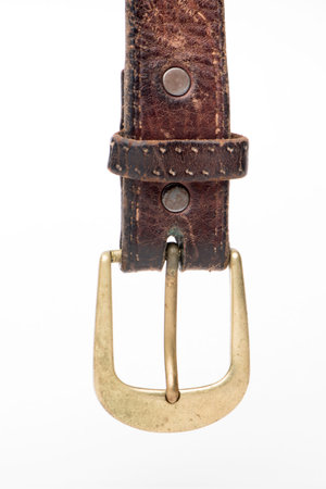 Rugged old Brown Leather Belt with brass buckle Isolated on White backgroundの写真素材