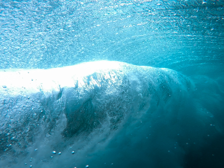 underwater wave, then breaks along the coast of Fuerteventuraの写真素材
