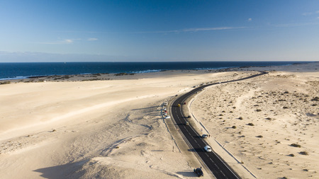 aerial view of road, desert, coast, fuerteventura, canary islandsの写真素材