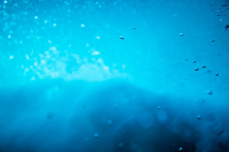 lights reflected and bubbles in the waterの写真素材