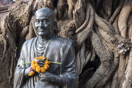 Thai monk statue, bangkok thailandの写真素材