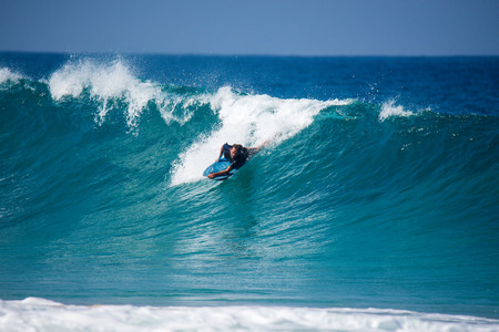 A surfer who surfers a big wave, fuerteventuraの写真素材