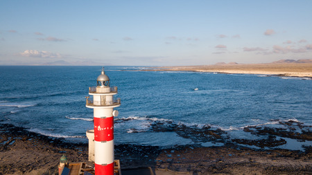 aerial view of lighthouse at sunset, north-west coast of fuerteventuraの写真素材