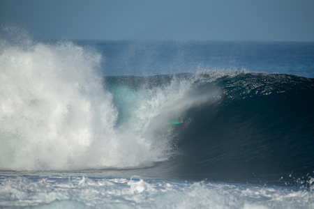 surfer in action on a big wave, lanzarote - canary islandsの写真素材