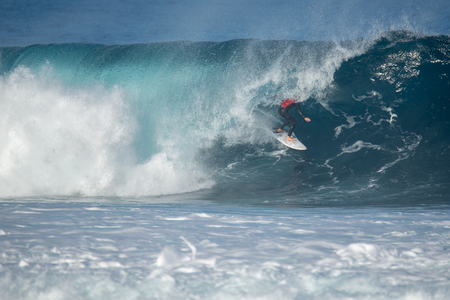 surfer in action on a big wave, lanzarote - canary islandsの写真素材