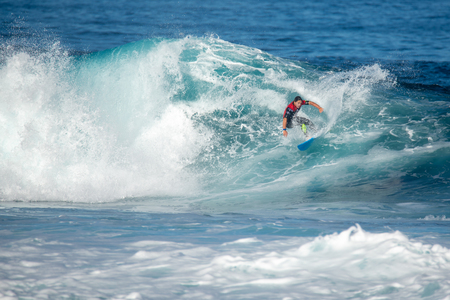 lanzarote - november 29, 2018: surfer in the big wave, competitionのeditorial素材