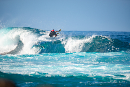 surfer in action on a big wave, lanzarote - canary islands