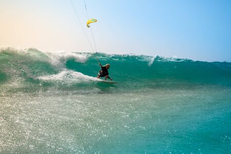 The kite surfer rides the waves of the Atlantic Oceanの写真素材
