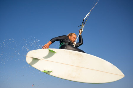 The kite surfer rides the waves of the Atlantic Oceanの写真素材