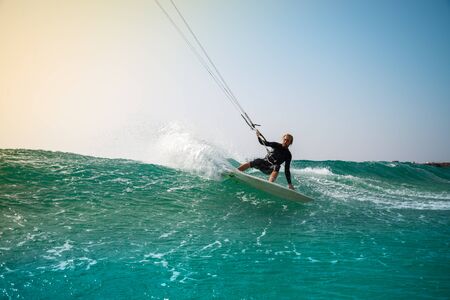 The kite surfer rides the waves of the Atlantic Oceanの写真素材