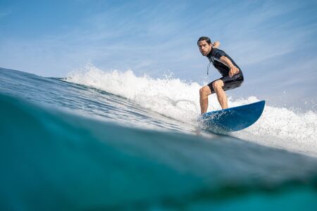 Fuerteventura - September 29, 2019: surfer riding waves on the island of fuerteventura in the Atlantic Oceanのeditorial素材