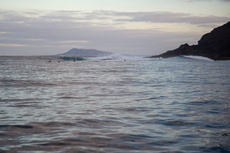 surfer riding waves in the atlantic ocean