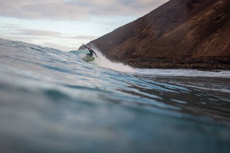 Surfer riding waves on the island of fuerteventuraのeditorial素材