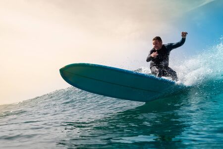 Surfer riding waves on the island of fuerteventuraの写真素材