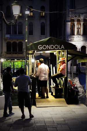 Customers waiting for a gondola ride, Grand Canal, Venice, Italyのeditorial素材