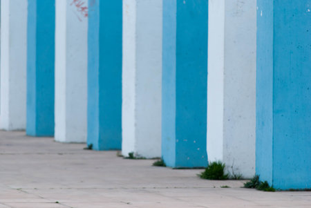 Blue and white columns with some graffiti