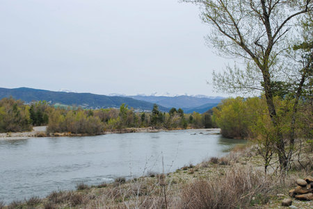 River surrounded by high mountains in a landscape full of mountains and nature