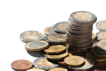 A lot of euro coin money on a white background for investing, trading and business enrichmentの写真素材