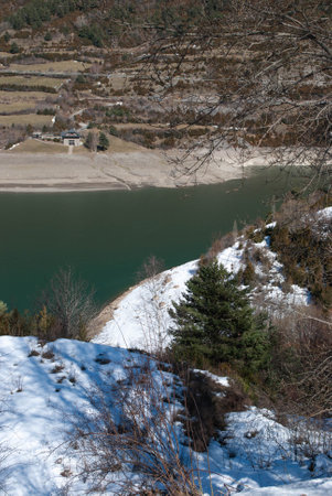 Tranquil Lake surrounded by breathtaking Mountainsの写真素材