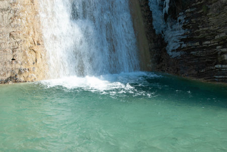 The power and beauty of a mountain waterfallの写真素材