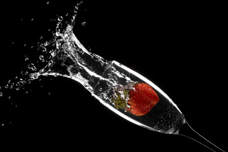 RED STRAWBERRY IN WATERの写真素材