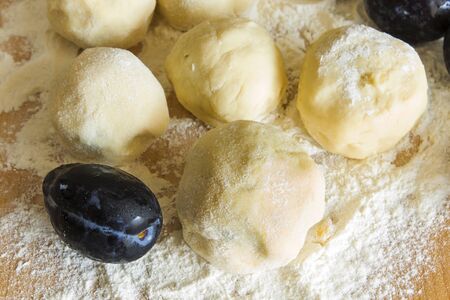 Plum dumplings on the plank table.の写真素材