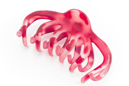 Pink hairclip isolated on white.の写真素材