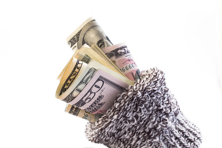 Money in a sock isolated on white.の写真素材