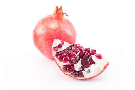 Ripe pomegranate isolated on white.の写真素材