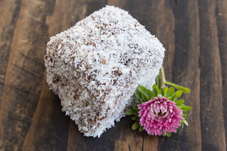 Brownie with Coconut on Rustic Board.の写真素材