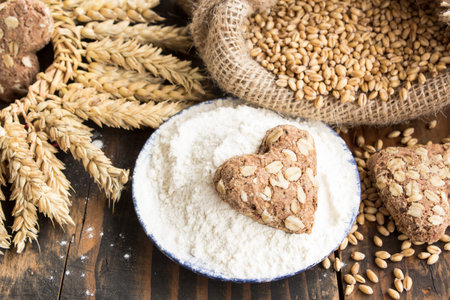 Wheat and Wheat Products on Rustic Wooden Background.