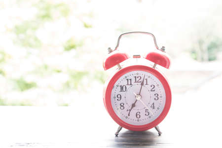Red Alarm Clock in the Open Window.の写真素材