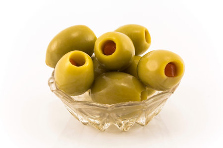 Green Olives Stuffed with Peppers, Isolated on White.の写真素材