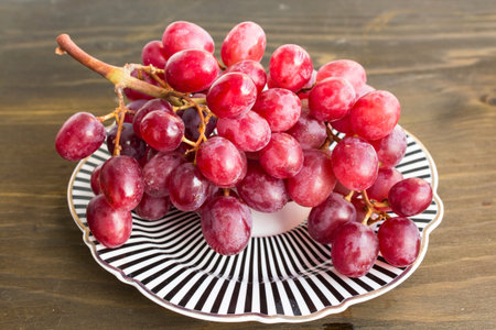 Red Sultana Seedless Grapes on a Plate.の写真素材