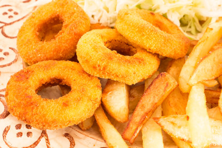 Fried Squid Rings with Fries and Cabbage Salad.の写真素材