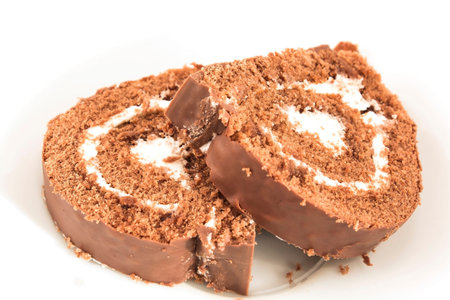 Sponge Cake Chocolate Roll on a Plate.の写真素材
