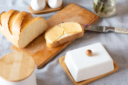 Bread and butter on the table. Beautiful kitchen still lifeの写真素材