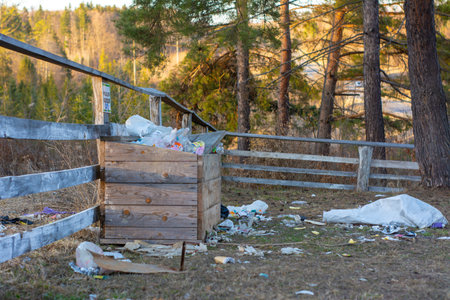 Garbage in nature. Garbage bin in the forest. Recyclables and garbage scattered in nature