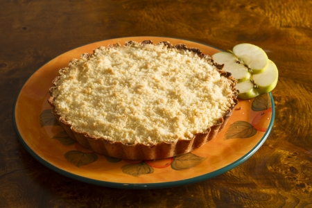 Apple cake with two slices of apple on an old wooden table の写真素材