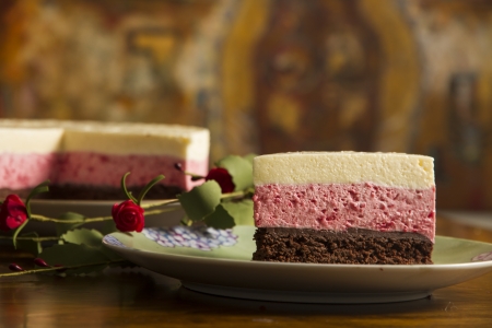 Chocolate mousse cake and strawberries with remaining cake background の写真素材