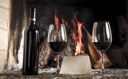 Wine by the fireplace, glasses of wine  Message  Sample text の写真素材