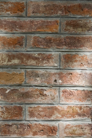 red brick wall texture grunge background with vignetted corners of interiorの写真素材