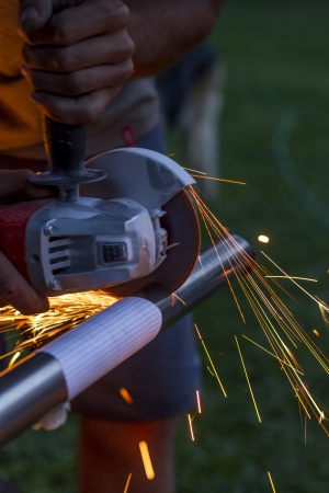 Man workin with iron, sparks の写真素材