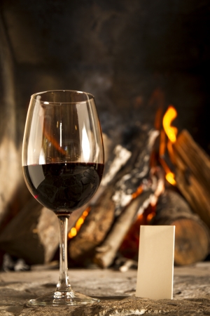 A cups of wine with fire on the background, romantic meal  Love  Write your own message の写真素材